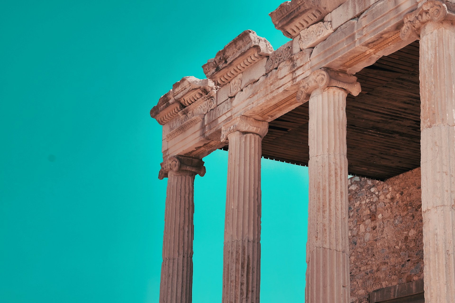 classical Greek/Roman style columns on a classical ruin with a bright futuristic sky background